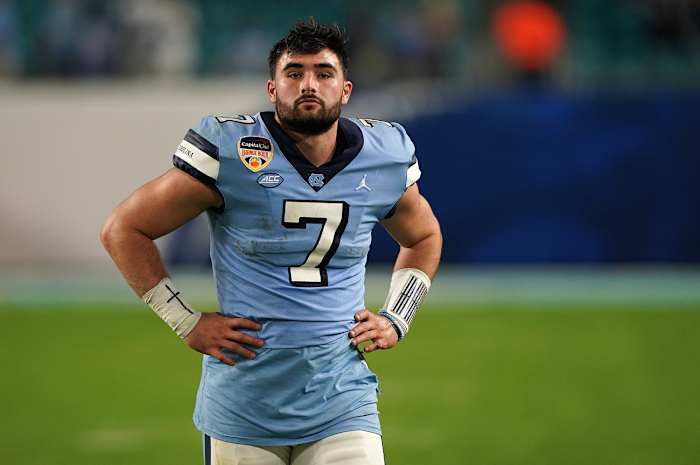 Jan 2, 2021; Miami Gardens, FL, USA; North Carolina Tar Heels quarterback Sam Howell (7) walks off the field after being defeated by the Texas A&M Aggies at Hard Rock Stadium.